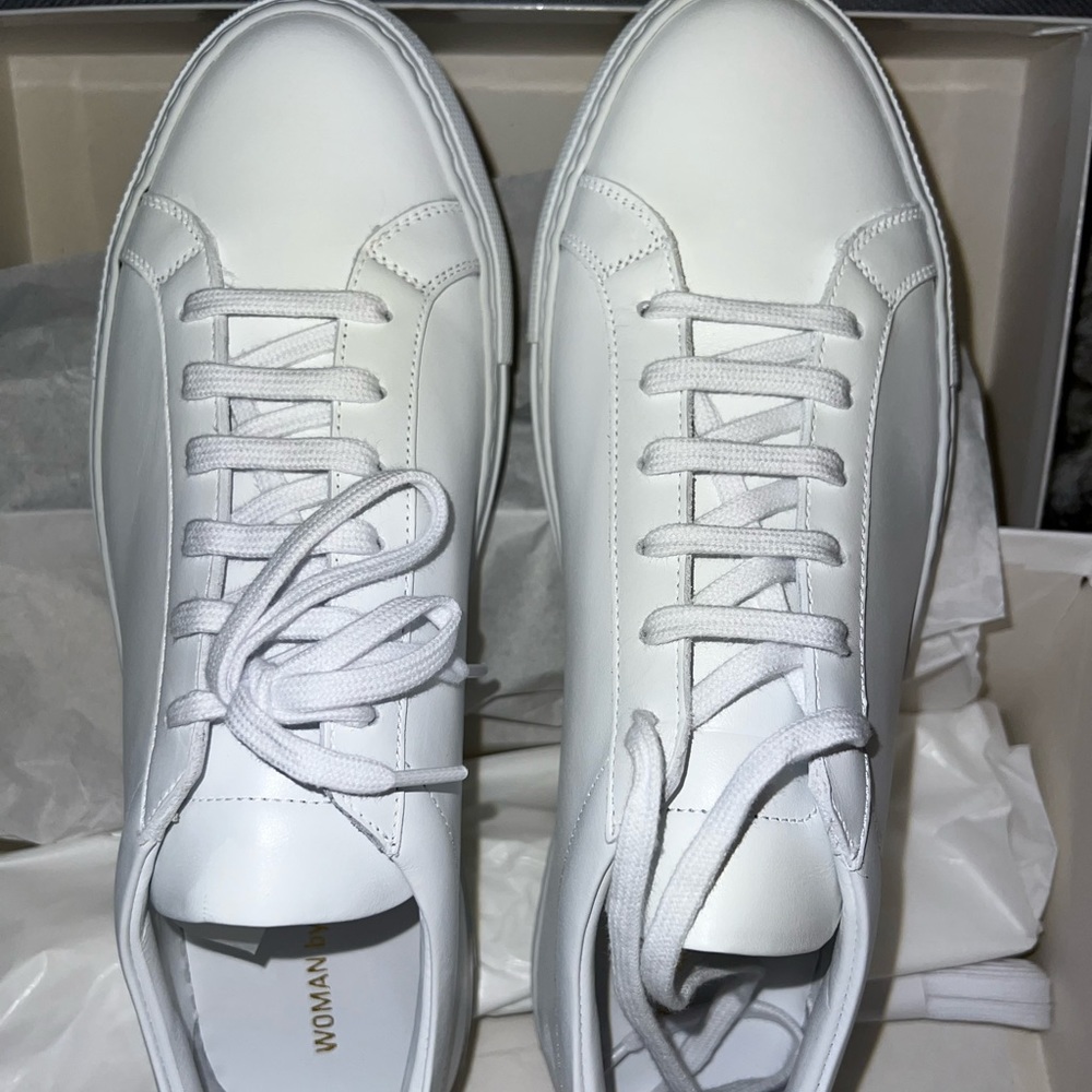 Woman’s White Common Projects Sneakers